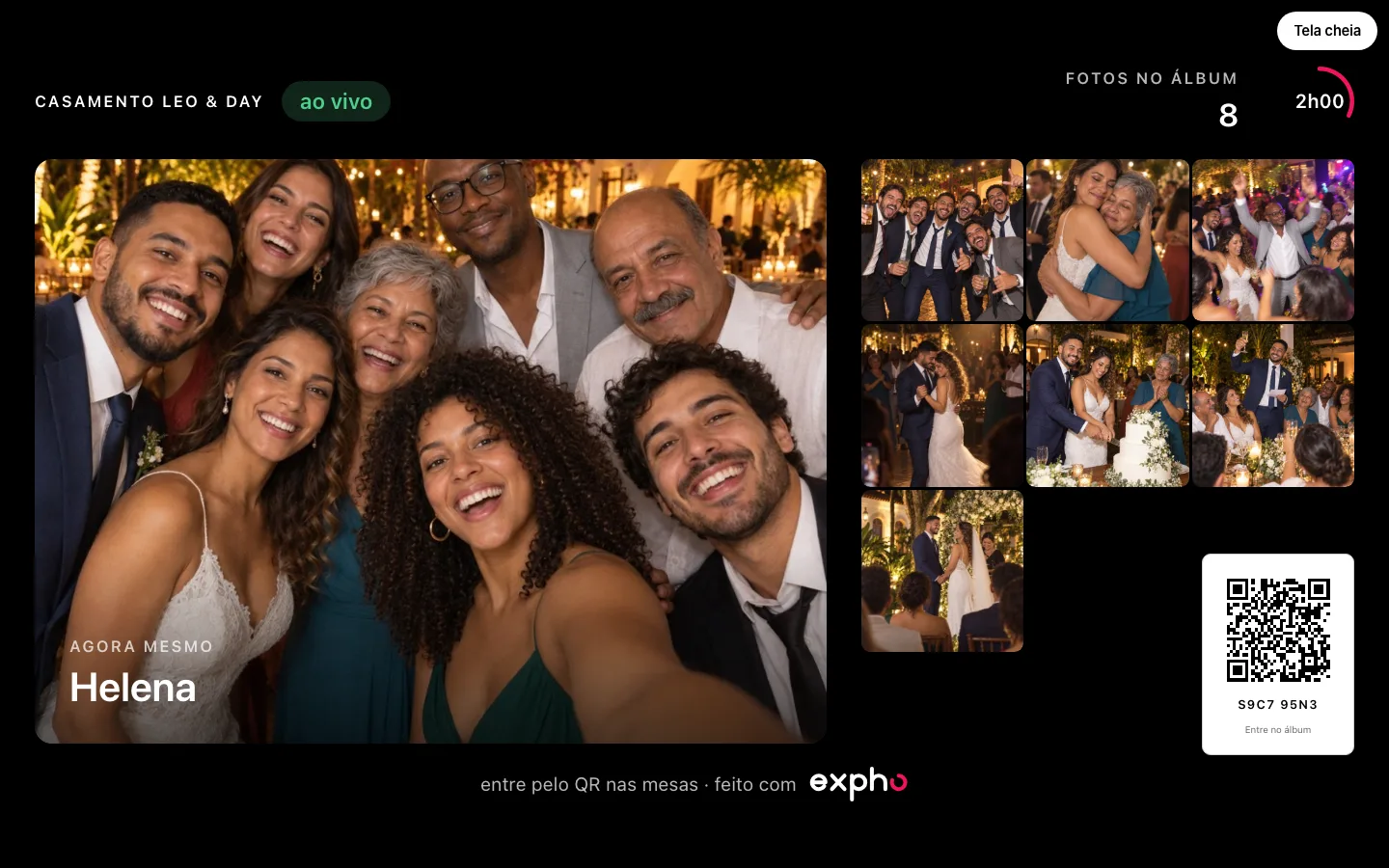 O telão em tela cheia com as fotos reveladas do evento
